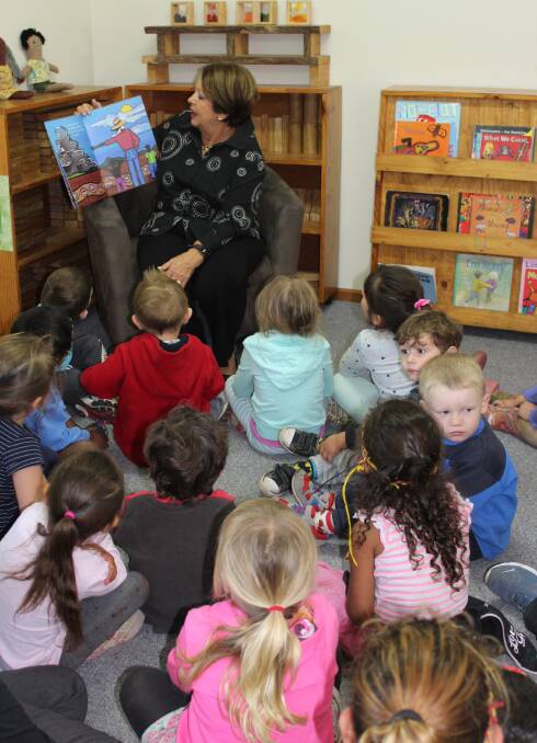 CAPTIVE AUDIENCE: Lady Lynne Cosgrove delighted children at the Eden Child Care Centre on Tuesday by reading them a story. Pictures: Liz Tickner 