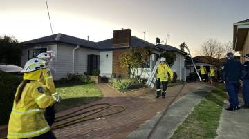 The rear of a Taralga Road house was damaged by fire late Saturday afternoon. Picture by Louise Thrower.