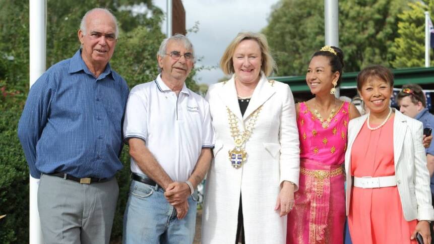 The National Australia Day Council has found that recent migrants topped the list of those most likely to partake in celebrations of Australia Day. Pictured is the Yass Valley mayor Rowena Abbey (centre) with citizens celebrating Australia Day in 2016. Photo: RS Williams
