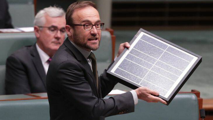 Adam Bandt with a solar panel during question time at Parliament House in Canberra on Monday 13 February 2017. Photo: Andrew Meares  Photo: Andrew Meares