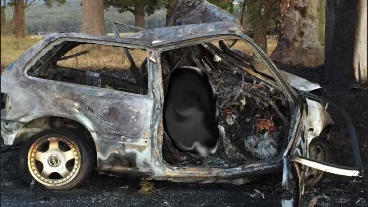 A photo of the incinerated car on Cleveland Road, Dapto.  Photo: Illawarra Police Rescue Squad