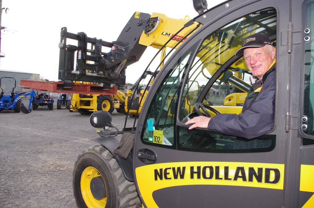 New Semco Goulburn sales manager John Walsh at the controls of a New Holland Telehandler. 