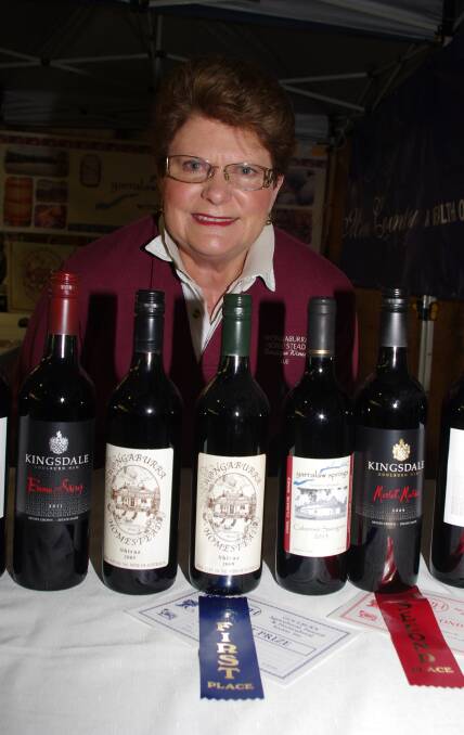 WINNING WINE: Sue Maas from Wongaburra Wines with her winning Goulburn Show entries along with wines from other Merino Country Vignerons.