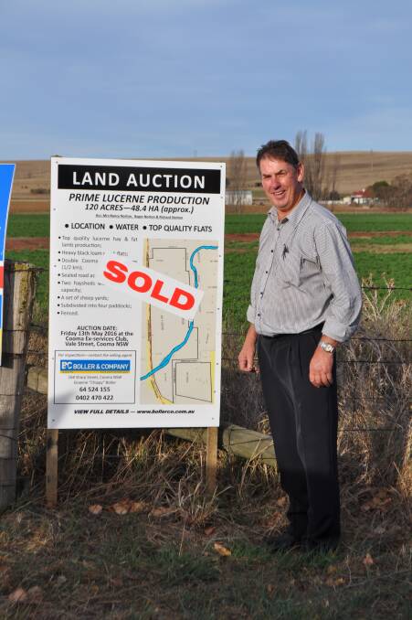 PROUD: Graeme ‘Chippy’ Boller after the sale of dry land lucerne flats at Bunyan, near Cooma. (Photo supplied) 