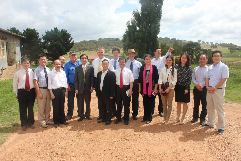 NEW EXPERIENCE: A delegation of Chinese agricultural students visited the Pelican Sheep Station owned by Goulburn farmer Phillip Sykes. Mr Sykes (fifth from left) is pictured with the group and delegation leader Mr Guo (sixth from left), Goulburn Mulwaree Mayor Geoff Kettle and councillor Robin Saville.