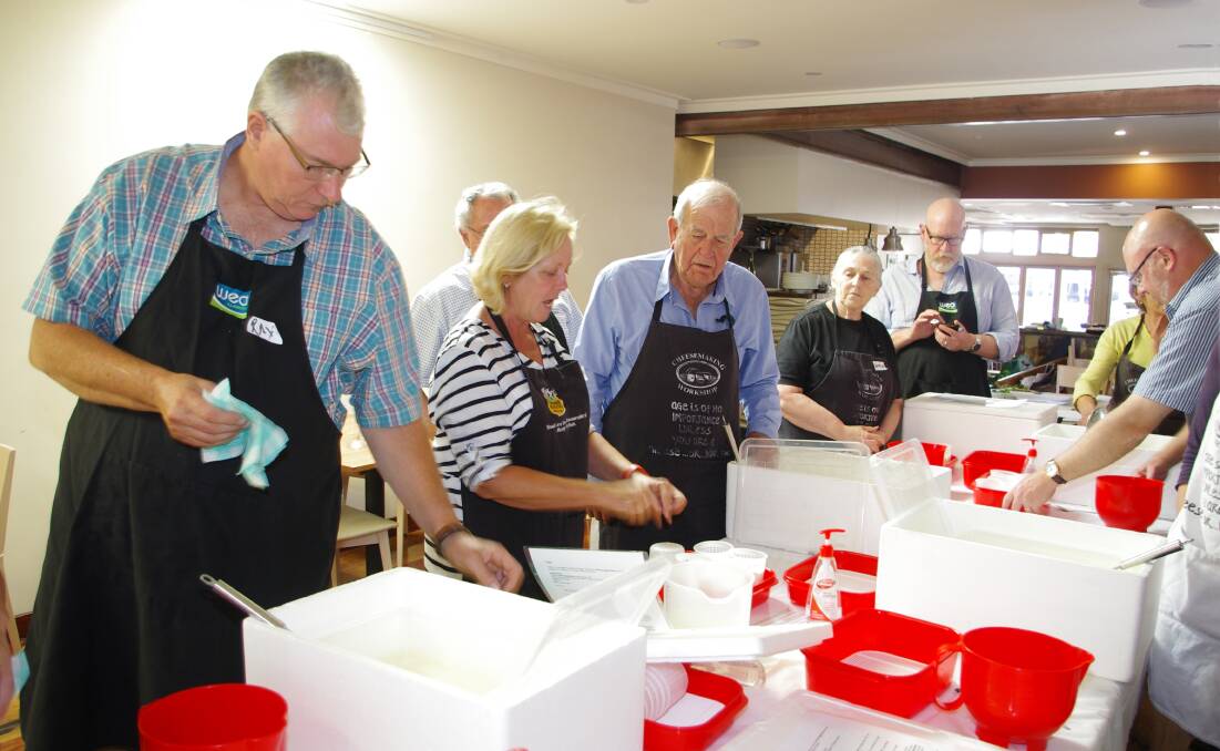 Goulburn participants in The Cheesemaking Workshops first class at 98 Chairs Restaurant last Tuesday, Ray Dennis, instructor Sue Magher, John Cordukes, Carolyn Kay, Mark Schiess and Jim Huntley prepare to invert their camemberts after a lunch which included the ricotta they made in the morning.
