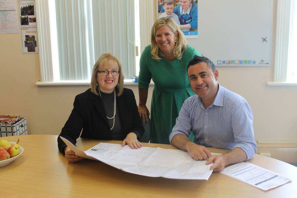 WORTHWHILE: Frances Robertson, principal of St Patrick’s Parish School, Cooma, Bronnie Taylor National’s Upper House Candidate & John Barilaro MP with the plans for the new look learning space to be included at the school.