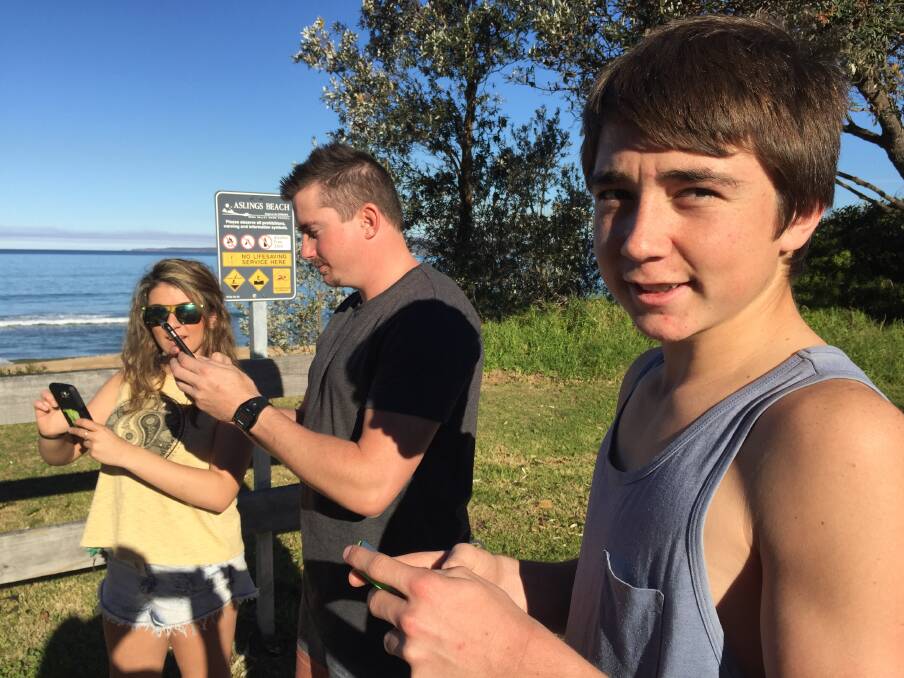 FRIENDS: Eden’s Rhyse Grewar (front) with Eden’s Nickolas Smith and Bega’s Tamika Johnson all met up at Asling’s Beach to collect Pokemon. (Photo: Eden Magnet) 