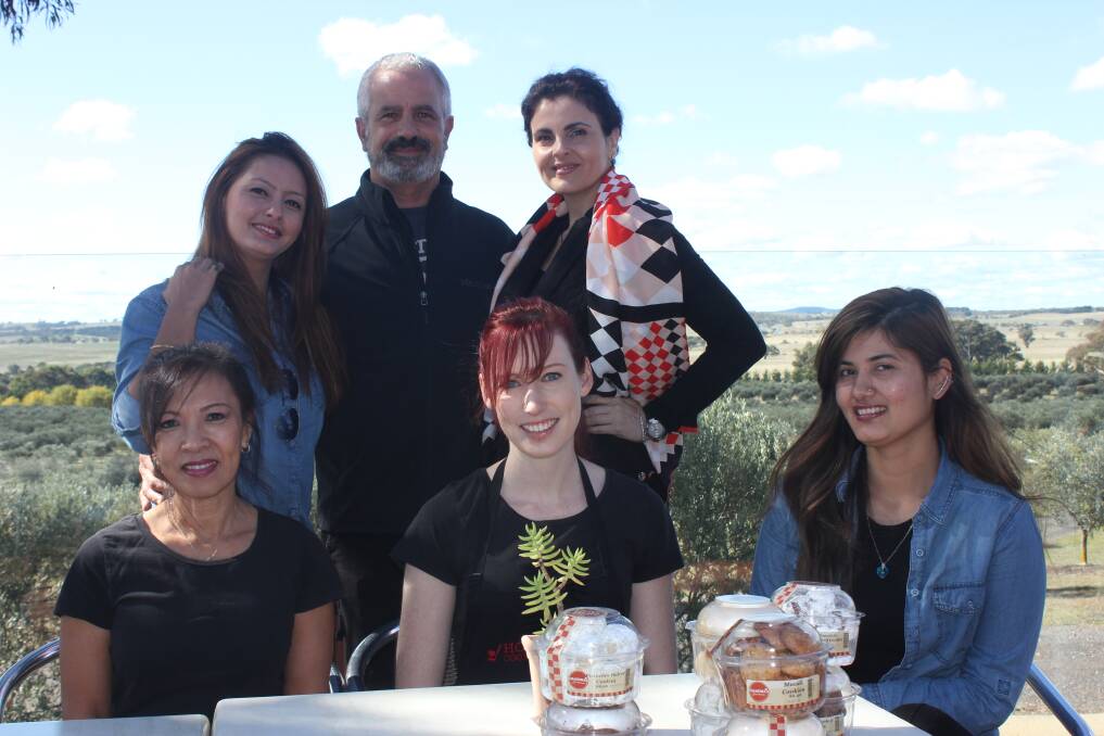 READY: Grandmas at the Farm owner/managers Avi Cohen and Dana Kvatinsky (centre back and right) with their staff Asmita (left,back), Mai Pham (front left), Laura Snell and Rinchan are ready and waiting to cater to your every need at the annual Olive Harvest Celebration this Sunday, May 31.