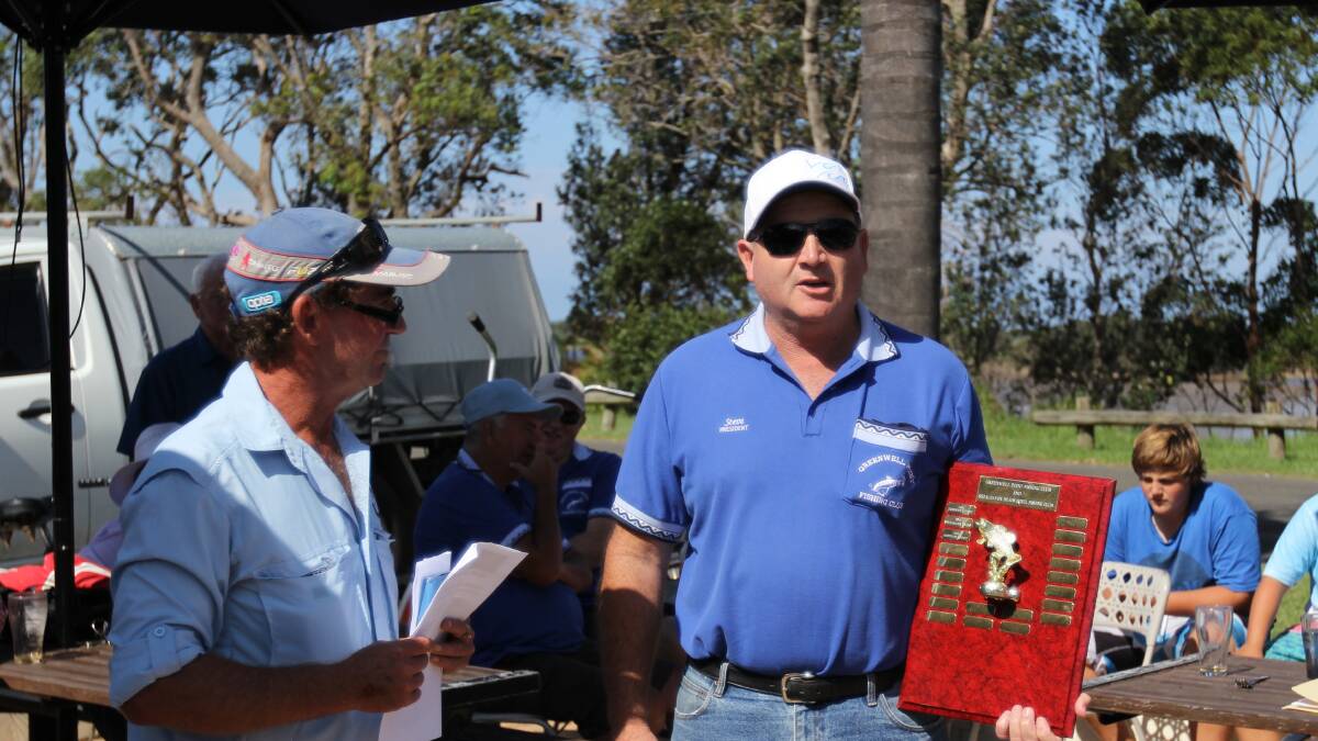 WINNERS ARE GRINNERS: Greenwell Point Fishing Club president Steve Brien receives the annual Top Ten Shoot Out trophy. 