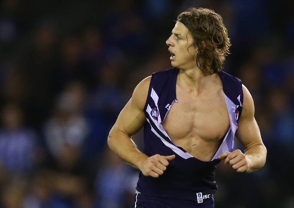 Nat Fyfe had his jumper torn in a scuffle during Fremantle's game against North Melbourne on Sunday where he was reported for making front on contact. Photo: Robert Cianflone/Getty Images. 