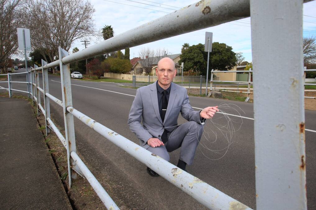 Chris O'Brien drove through a length of wire strung up across the Hallam Street bridge. Picture: Peter Weaving