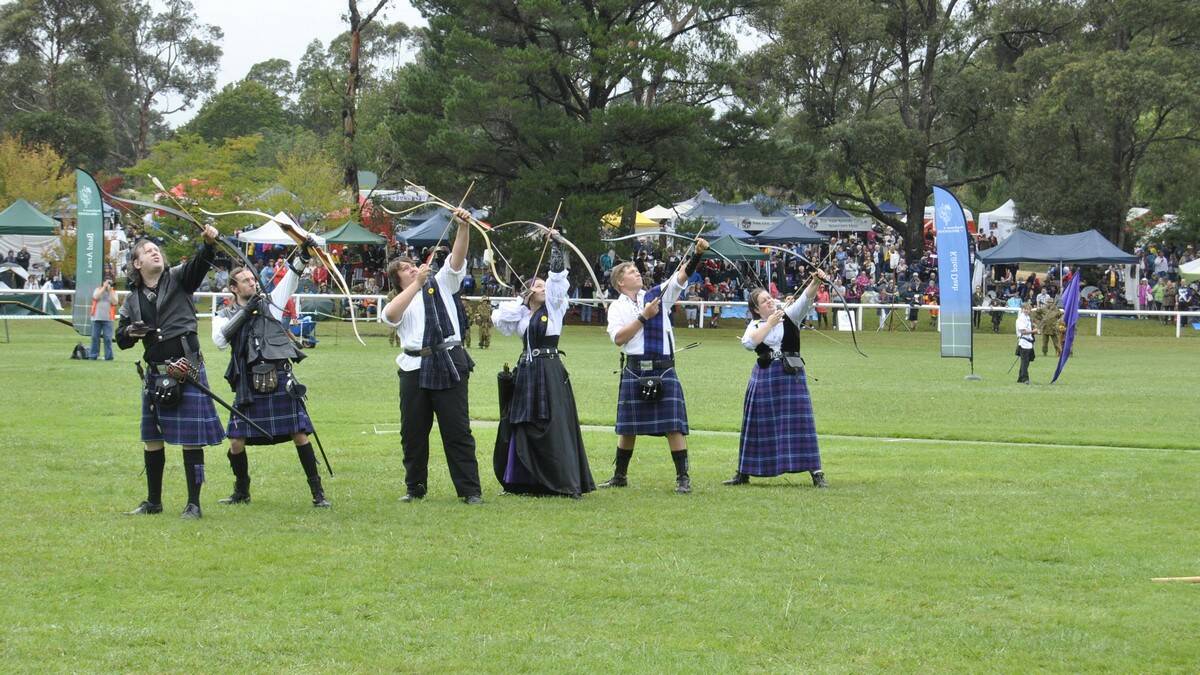 Scottish archers release a volley of arrows on their Irish foes. Photo by Megan Drapalski