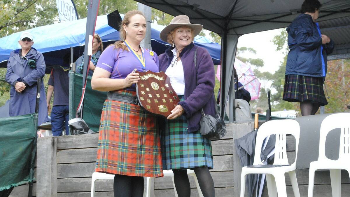 Carma Burchell is awarded female champion by Chieftain of the Day Valerie Cairney. Photo by Megan Drapalski