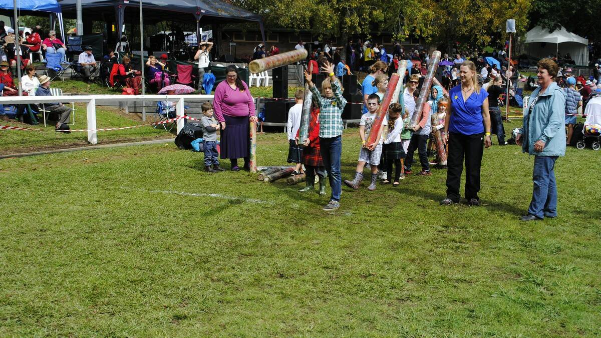 Perry Mehan (10) tries his best in the caber toss. Photo by Dominica Sanda