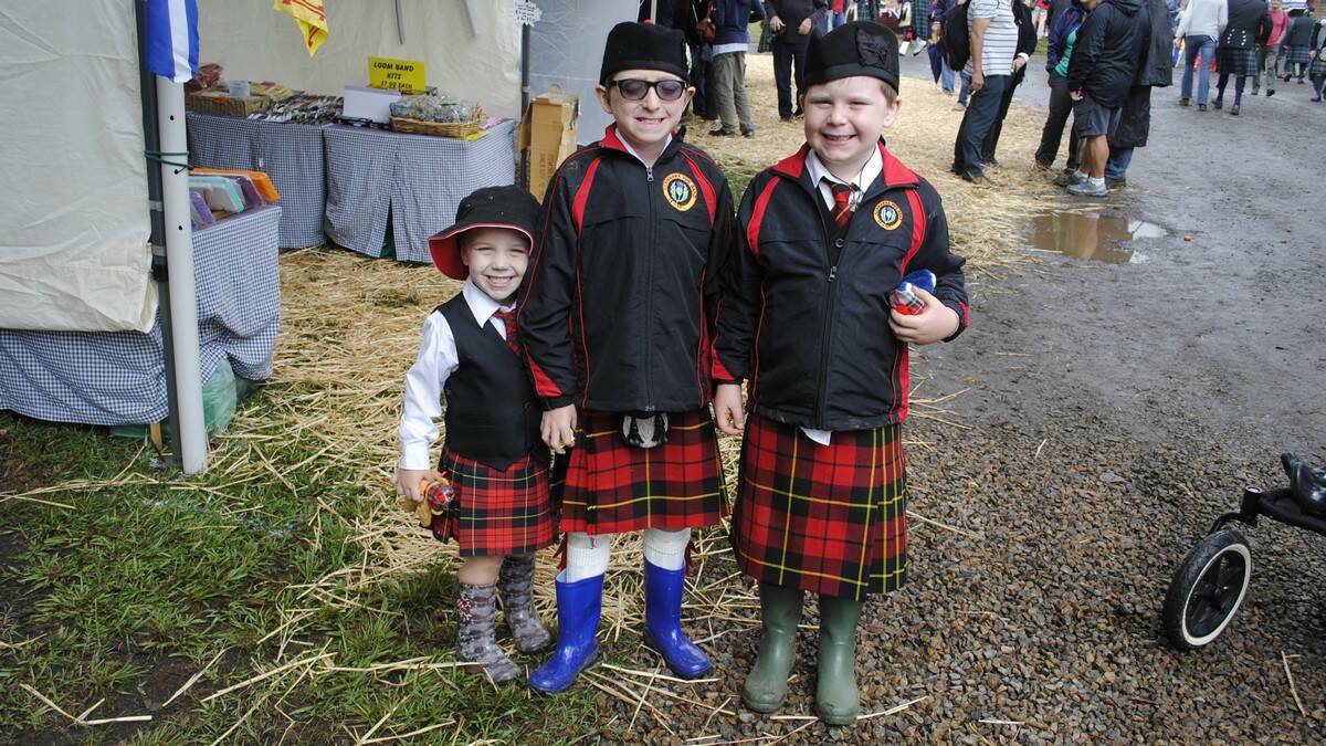 Campbell, 3, Kaeden, 9, and Kallan, 7, look dashing in their tartan kilts and gumboots. Photo by Dominica Sanda