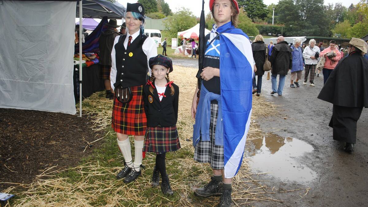 Lilly, Xanthe, 8, and Zen Chalmers stand proudly in their Scottish outfits. Photo by Dominica Sanda