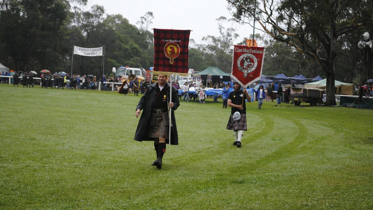 Scottish clans marched with their flags raised high onto Bundanoon Oval. Photo by Dominica Sanda