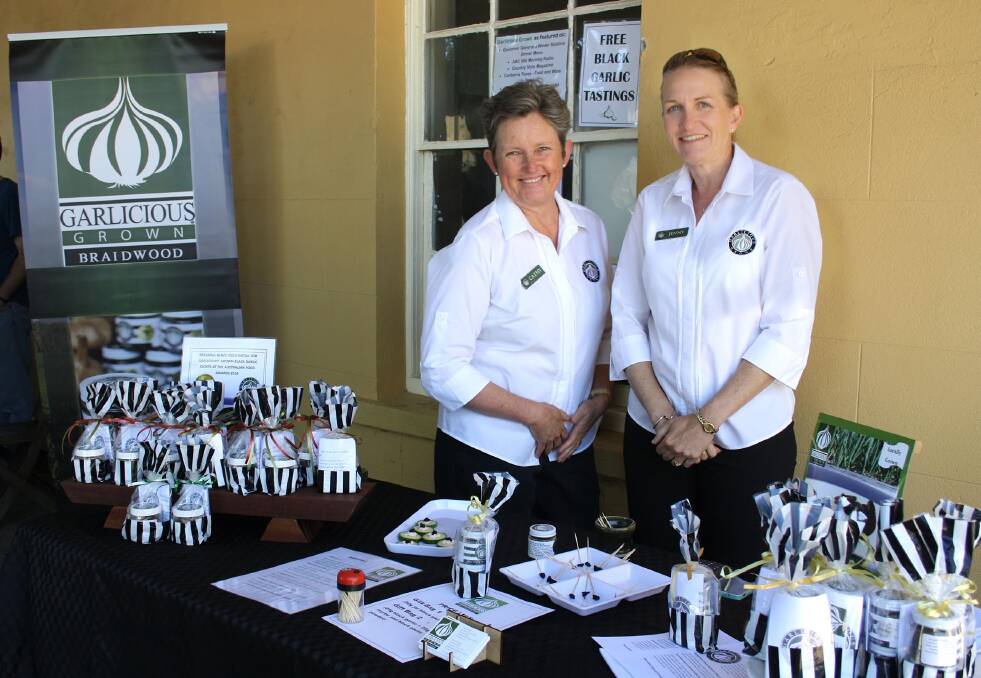 BLACK GOLD: Jenny Daniher and Cathy Owens with their black garlic in Braidwood. Photo: supplied.