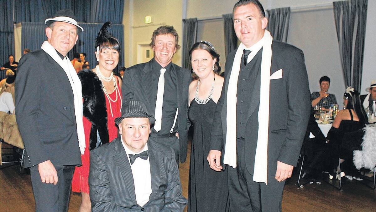 GLAM: Mark Gibbs (MC), Jenny Field, Troy Cook (a past patient), Graham Wilson, Kim Storey and Owen Finegan (CEO Snowy Hydro SouthCare) got into the spirit of the event’s theme, ‘Glam, Glitz and Gangsta’.  Photo courtesy YASS TRIBUNE.