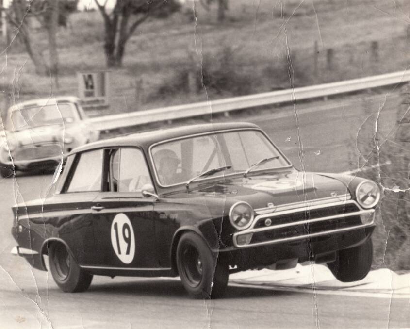 CORNERING HARD: George Garth in his modified Lotus Cortina with a Cooper close on his tail at Bathurst Easter 1972. This and other historic racing images are available at www autopics.com.au