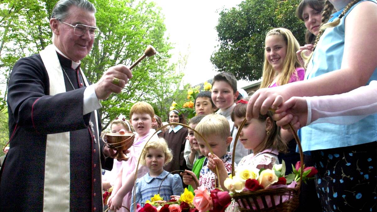 Archbishop Francis Carroll blesses flowers in 2001. Picture by Peter Wells