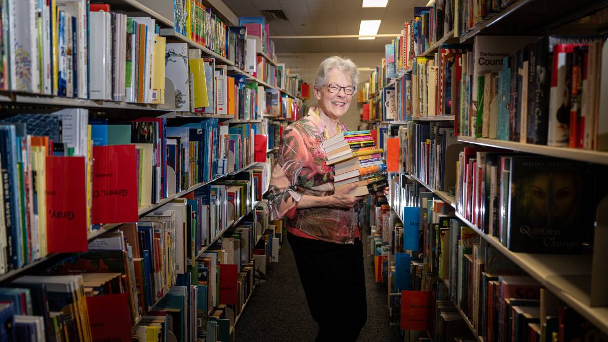 Emeritus Professor Belle Alderman amid the collection of Australian children's literature. Picture by Karleen Minney