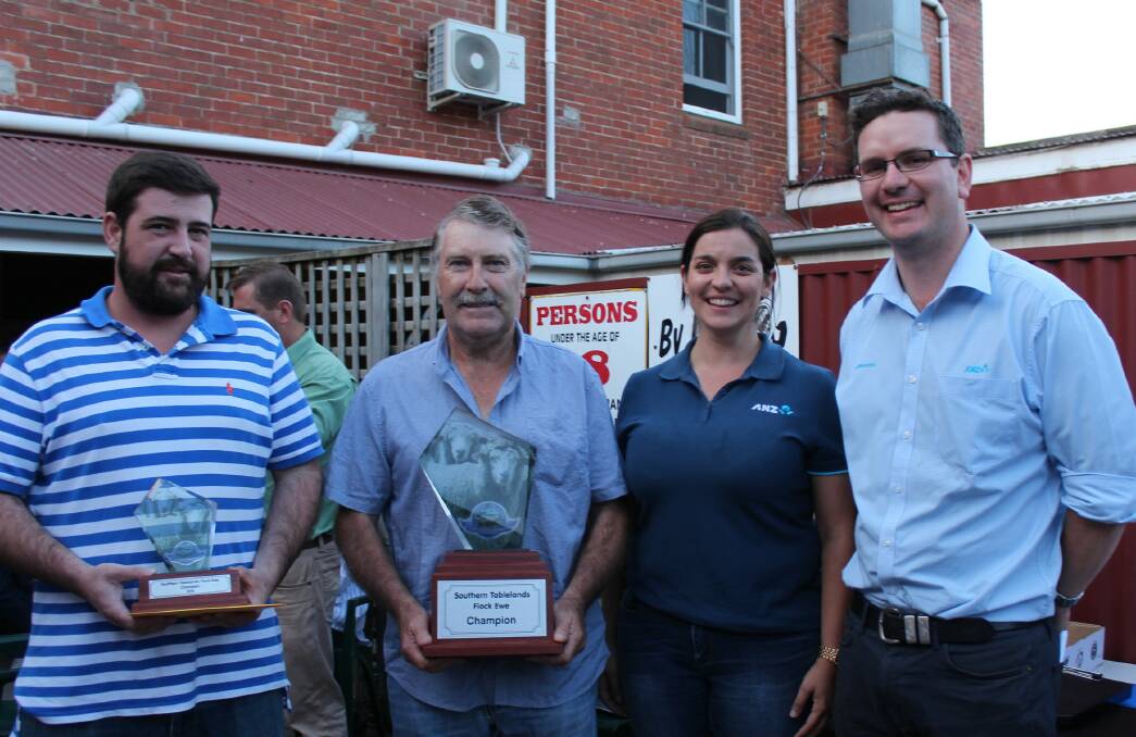 PROUD MOMENT: Daniel and Brad Cartwright, “Kempton”, Crookwell are presented with their prizes for winning the 2018 Southern Tablelands Flock Ewe Championship by Adele Fiene and Andrew Treweeke from ANZ.
