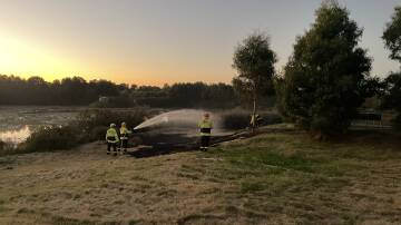 Goulburn's NSW Fire and Rescue personnel extinguished a fire at Goulburn wetlands at Eastgrove on Saturday night. Picture by Louise Thrower.