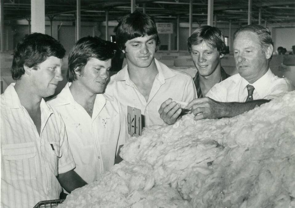 WOOL DYNASTY: The late Trevor Picker (right) with sons Danny, Murray, Grant and Brett at wool sales in Goulburn in 1982. Photo: Leon Oberg.