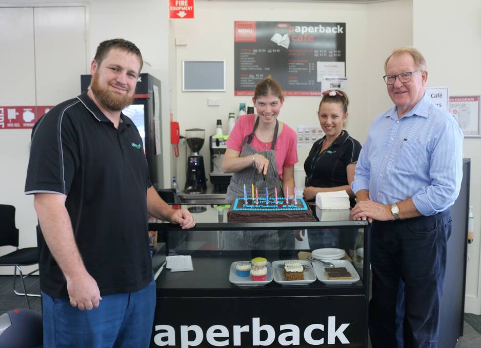 Goulburn Mulwaree Council's youth services coordinator, Luke Wallace, Chloe Rudd, Chantelle Evans and former mayor Bob Kirk at the Paperback Cafe when it celebrated its second birthday in 2021. Picture supplied.