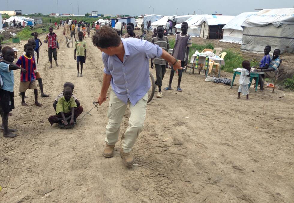Mr Elder entertaining children in South Sudan in his role with UNICEF. He says he's continually inspired by the resilience of poverty-stricken communities.