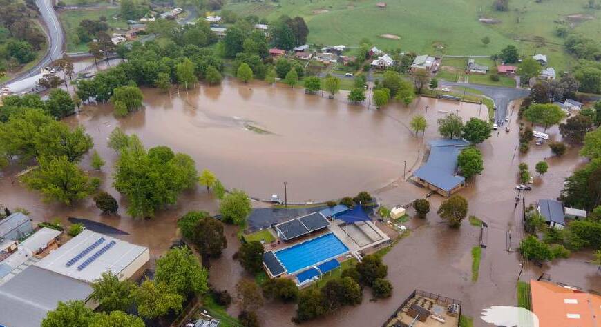 Drone footage shows the Tumbarumba football grounds and caravan park totally submerged in water. Picture: NSW SES