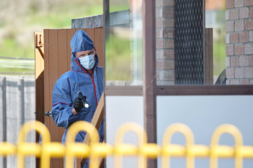 Forensic scientists investigate the Colac Court residence where the two men lived before Gale murdered Noel. 