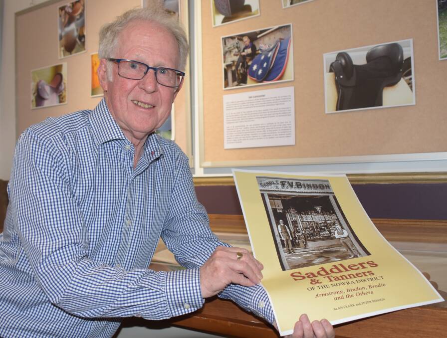 Prolific Shoalhaven historical author Alan Clark with the cover of his latest book Saddlers and Tanners of the Nowra District.