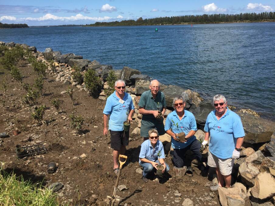 
PROJECT: Bolong landowner Jim Knapp with Shoalhaven Riverwatch members Ron Cowlishaw, Margie Jirgens, Peter Jirgens and Tim OShea planting mangroves on the edge of the Shoalhaven River.

