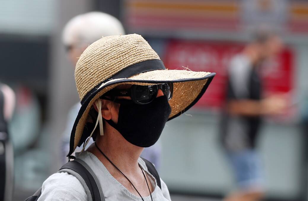 People in Wollongong CBD wearing masks. Picture: Robert Peet