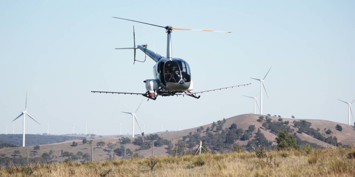 Hill Country Specialist: Precision and accuracy across hilly terrains. Heli Ag Aviation is your local aerial application specialist, proudly based in Crookwell and servicing Central and Southern NSW. Photo: Supplied.