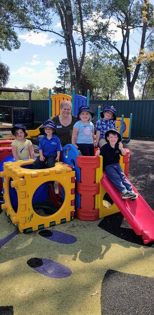 Places available: Director Melissa Byrne with Marulan Preschool students (left to right) Peyton, Beau, Jayda, Jaxon and Tristian (on slide). Photo: Supplied.