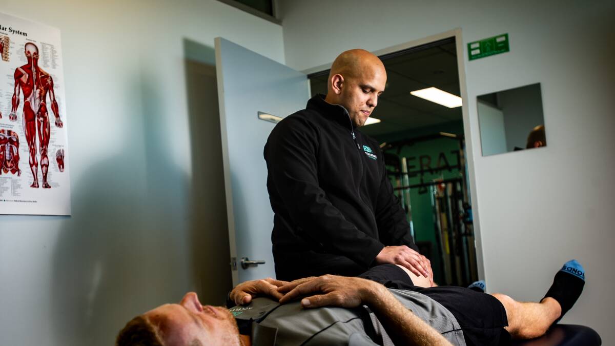 Physiotherapist Adnan Asger Ali has seen a jump in clients suffering pain due to bad home office set-ups. Picture: Elesa Kurtz