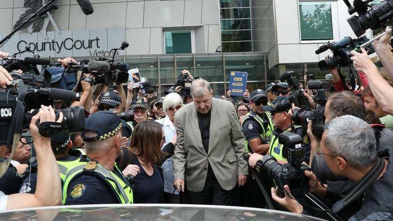 Cardinal George Pell heckled at court after guilty verdict