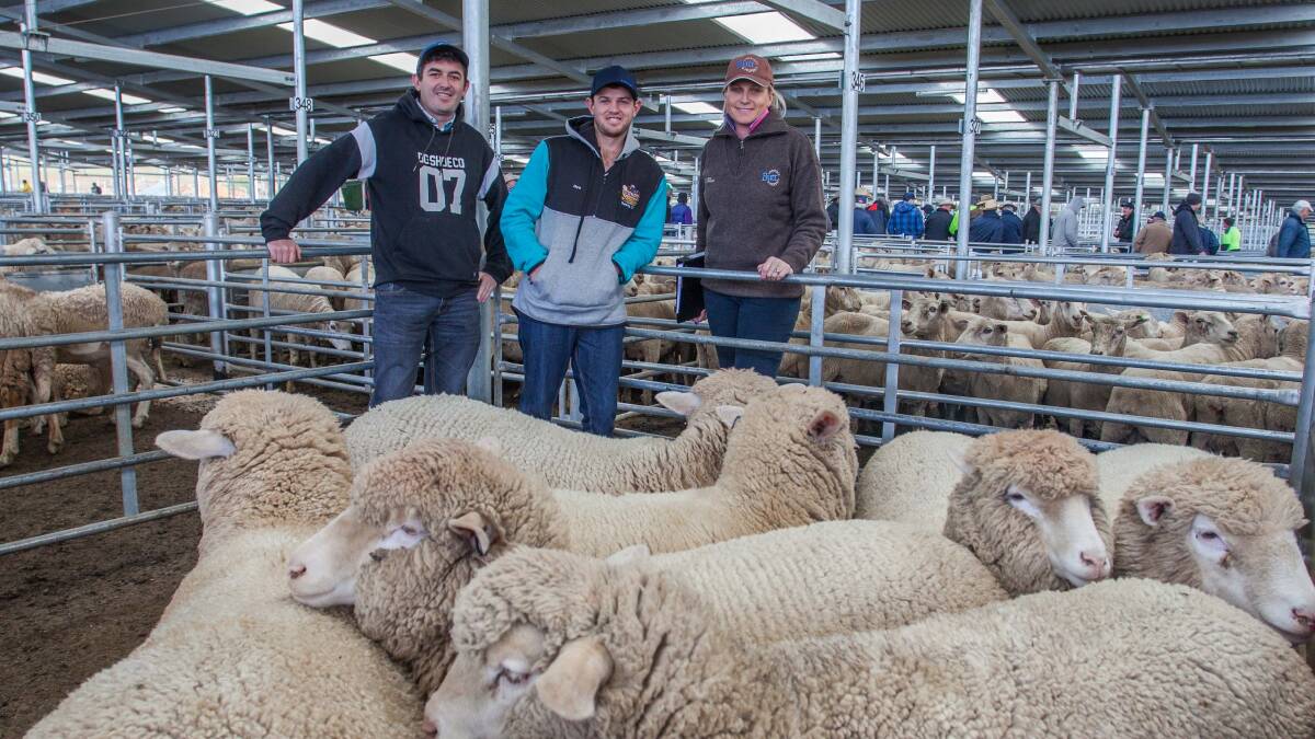 Ben and Chris Bowman of Yass with Sally Butt, Butt Livestock & Property, who sold their XB Lambs to a sale top of $190.20. Photo: Heidi Grange