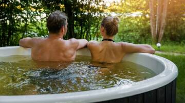 Imagine the pleasure of slipping into the warm, bubbling waters of your own backyard spa after a long day, the stresses of life melting away. Picture Shutterstock