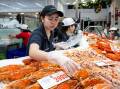 The Sydney Fish Market expects to sell more than 350 tonnes of seafood in the next two days. (Steven Markham/AAP PHOTOS)