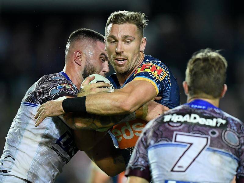 Bryce Cartwright (centre) playing harder for the Titans in 2019.