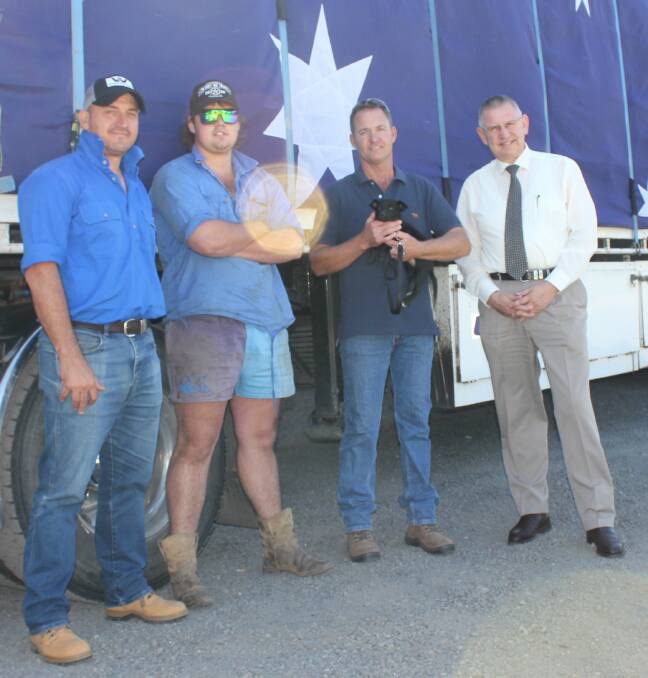 DONATION: Mr Howes and Mr Boag with Goulburn Mulwaree Mayor Geoff Kettle and the truck full of 50 bales of hay that the council has donated for the Burrumbuttock Hay Run.  