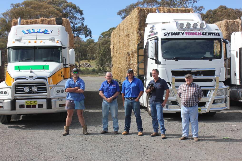 READY: Brendan Howes (left), David Hayter from Hayters Haulage of Sutton Forest, Sales Manager from Sydney Truck Centre, Shane Boag, Damien White from the Merino Cafe at Gunning (with kelpie puppy ‘Trixie’) and Bill Fife from Fife’s Stockfeeds, Goulburn.