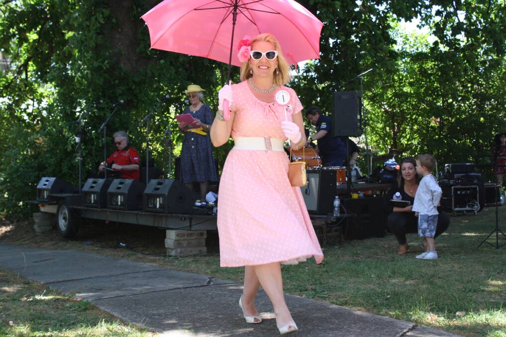 Monika shows off her op shop find in the Vintage Fashion Parade - a great, pink, polka dot dress with matching umbrella, hair flowers and gloves.